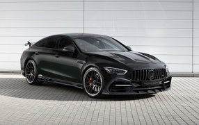 Black car Mercedes-AMG GT 63 S 4MATIC + 4-Door Coupé Inferno 2020 at the garage