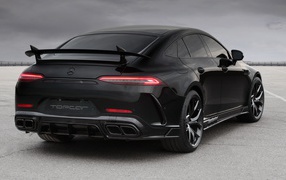 Black car Mercedes-AMG GT 63 S 4MATIC +, 2020 rear view on gray background
