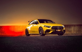 Желтый автомобиль Mercedes-AMG A 45 S,  2020 года на асфальте 
