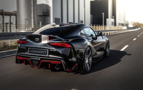 Черный Manhart Supra GR 450 2020 года на дороге вид сзади