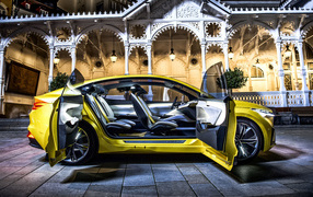Yellow 2018-2019 Skoda Vision IV SUV on the background of the house