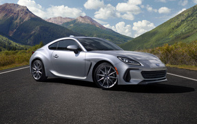 Silver Subaru BRZ car, 2022 against the backdrop of mountains