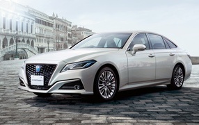 Stylish car Toyota Crown S, 2020 on the background of the building