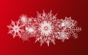 Красивые ледяные снежинки на красном фоне