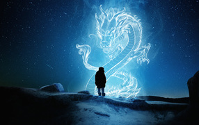 A man looks at a big Chinese dragon in the starry sky.