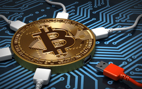 Кабель USB подключен к монете биткоин