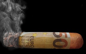 Cigar from euro banknotes on a black background