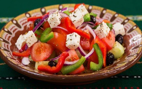 Appetizing Greek salad in a plate on the table