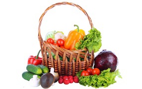 Basket with vegetables on a white background