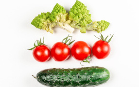 Cabbage, tomatoes and cucumber on a white background