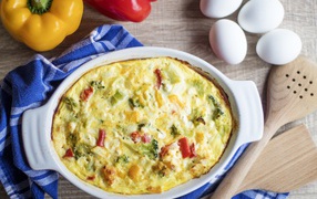 Casserole on the table with peppers and eggs