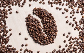 Рисунок к зерна на столе из жареных кофейных зерен 