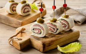 Lavash rolls with ham on the table