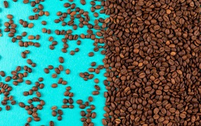 Lots of roasted coffee beans on a blue background