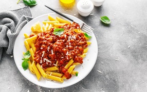 Pasta with sauce on a white plate