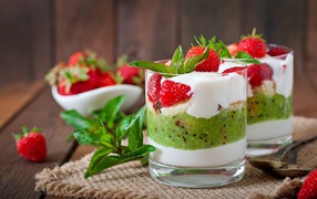 Yogurt with kiwi and strawberries in a glass with mint