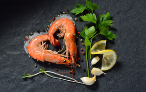 Shrimp heart on a gray table with lemon and a sprig of parsley
