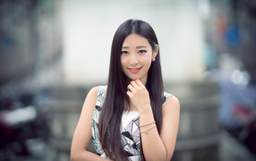 Cute long-haired Asian girl with a beautiful smile