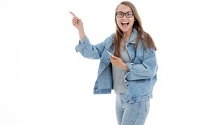 Girl in a jeans suit with glasses on a white background
