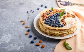 Pancake cake with nuts and blueberries for Shrovetide 2020