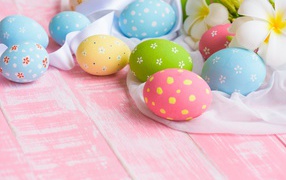 Beautiful multi-colored eggs on the table for Easter holiday