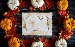 Sheet of paper, pumpkins and leaves background for Halloween cards.