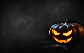 Terrible pumpkin on a gray background, template for Halloween cards