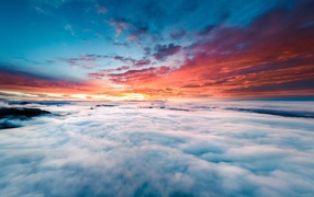 Sunrise in the sky above the clouds