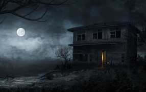 Old abandoned house at night by the light of the moon