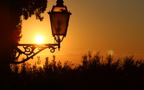 Lantern on the house at sunset