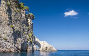 Stone cliff with an arch into the sea, Zakynthos island. Greece