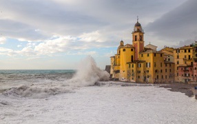 An ancient church on the shores of a raging sea, Camogli, Liguria. Italy