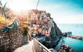 Houses in the city on a cliff by the ocean, Italy