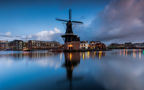 Old mill by the river in the evening, Netherlands