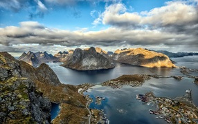 Lofoten Islands under a blue sky with white clouds, Norway