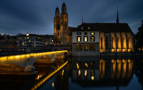 Big house by the river at night, Zurich, Switzerland