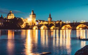 Charles bridge over the night river, Prague Czech Republic