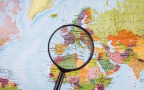 Magnifying glass on a world map