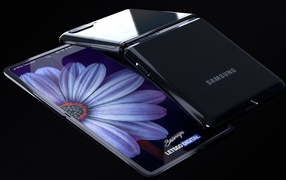 Bendable smartphone Samsung Galaxy Z Flip on a black background