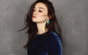 British actress Jessica Barden against a gray wall