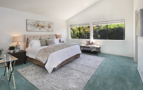 Gray bedroom interior with king size bed.