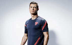 Handsome man, soccer player Cristiano Ronaldo on a gray background