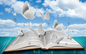 Бумажные бабочки и буквы над книгой 