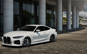 White 2021 BMW 4 Series Coupé M Sport Package in front of the building