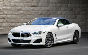 White BMW 8 Convertible, 2021 against the wall