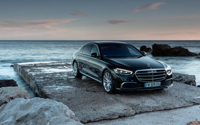 Black expensive car Mercedes-Benz S 400 D 4MATIC by the sea