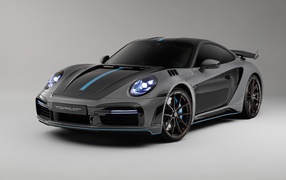 Спортивный автомобиль Porsche 911 Turbo S Stinger GTR 3 2021  года на сером фоне