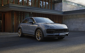2021 Porsche Cayenne Turbo GT crossover in front of the building