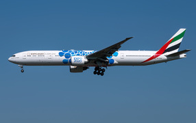 Emirates airline passenger Boeing 777-300ER in the sky