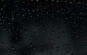 Splashing rain on black background